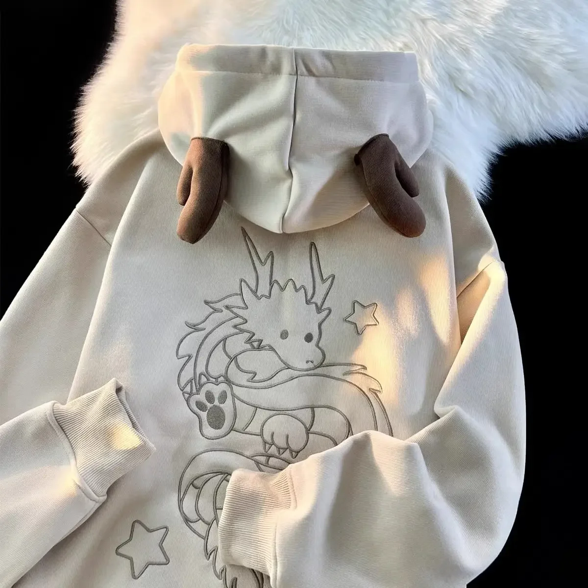 Dragon embroidered hoodie with horns